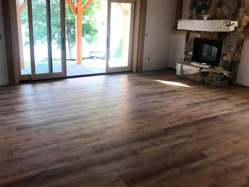 Landry Wood Flooring - Kitchen hardwood floor install and fireplace border Merrimack Valley